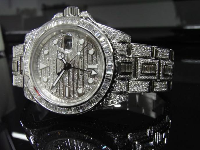 The 40 mm copy Rolex GMT-Master II 116769TBR watches have diamond-paved dials.